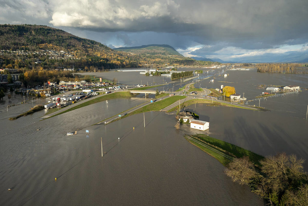 Flood waters cover Highway 1 in Abbotsford, B.C., Tuesday, Nov. 16, 2021. THE CANADIAN PRESS/Jonathan Hayward